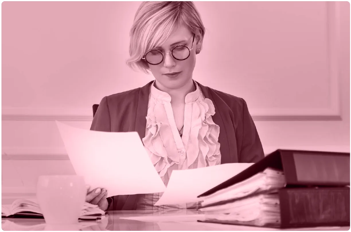 A public notary checking the files of the successful candidates